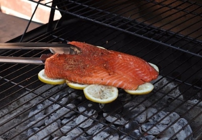 8. Grill fish on lemon slices to prevent it from sticking to the grill and add some extra flavor
