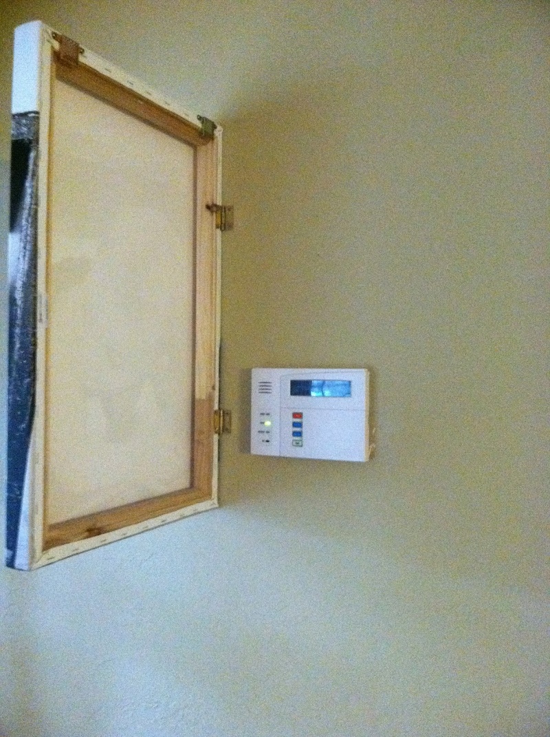 2. Hinged Painting to Cover That Ugly looking Thermostat