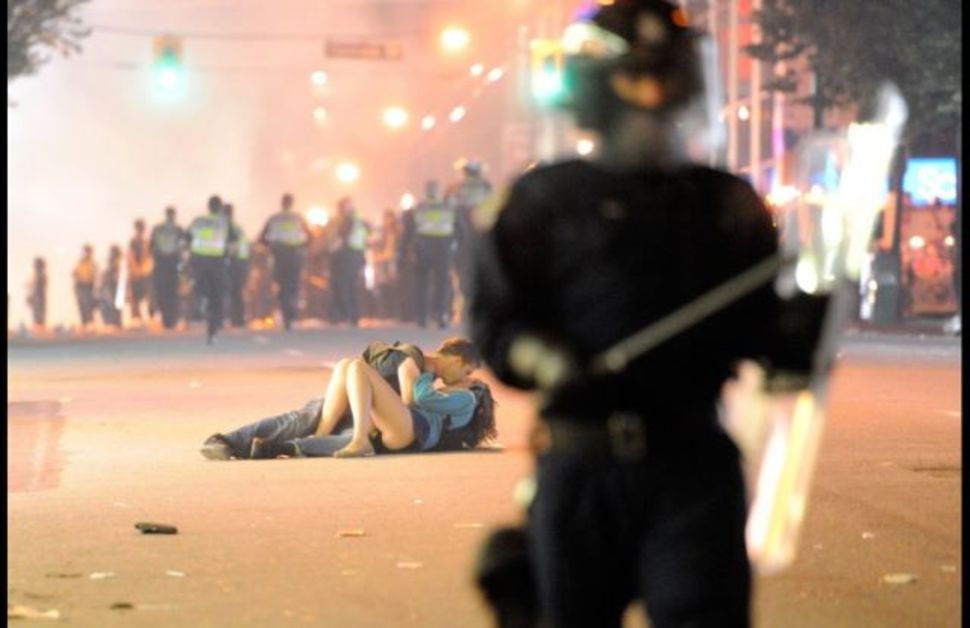 20. Boyfriend helps his injured girlfriend during a protest in Vancuver