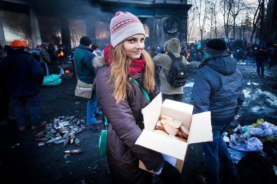 23. Girl delivers sandwiches to protesters in Ukraine