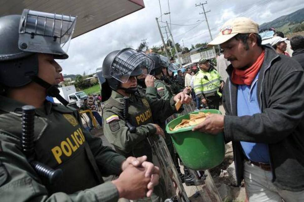 8. Protesters share their crackers with the riot police in Columbia