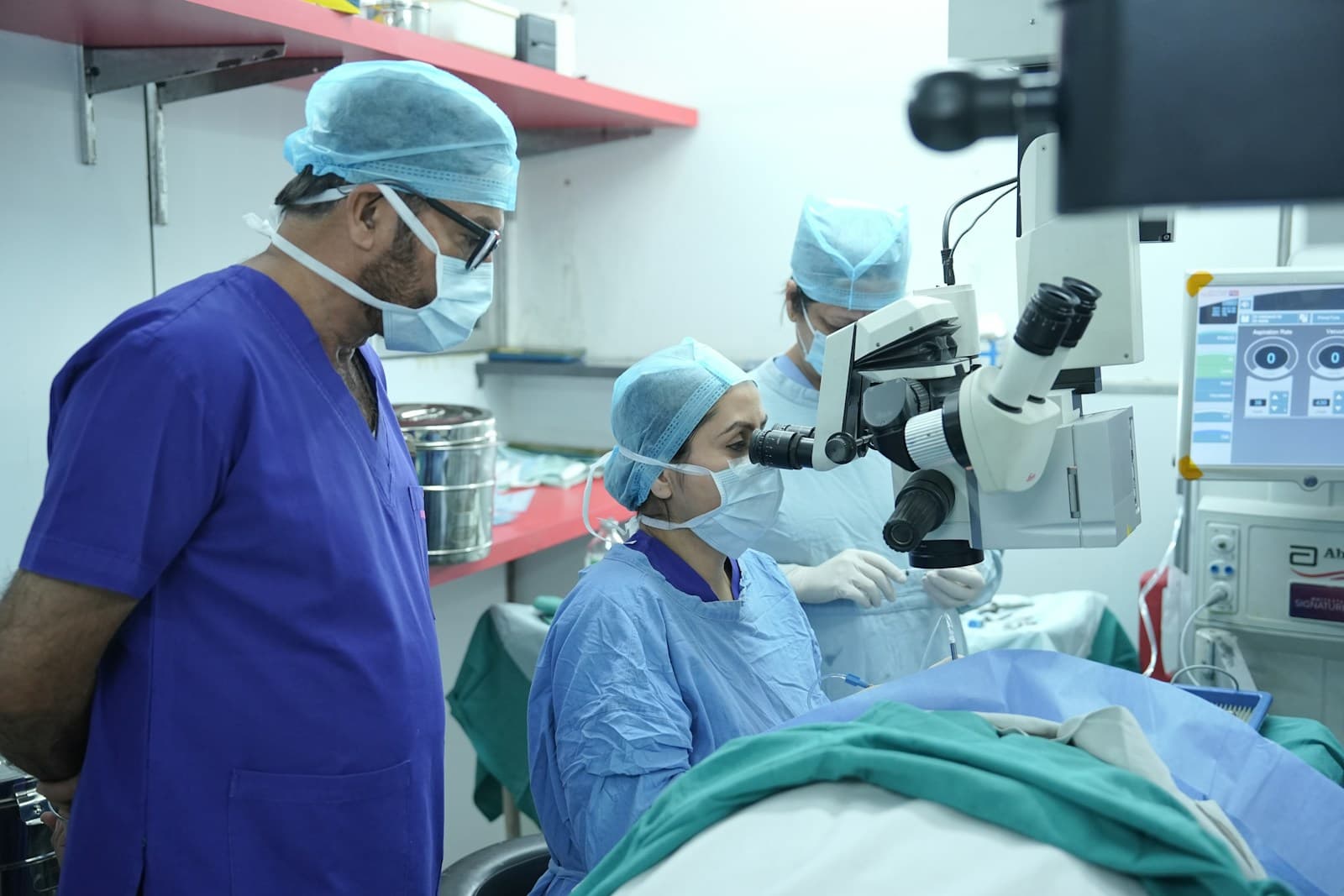 Doctors are performing surgery in an operating room.