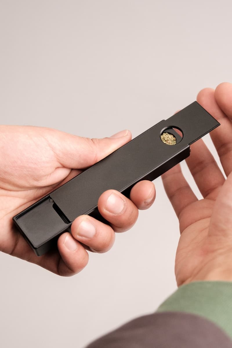 a person holding a black object in their hand