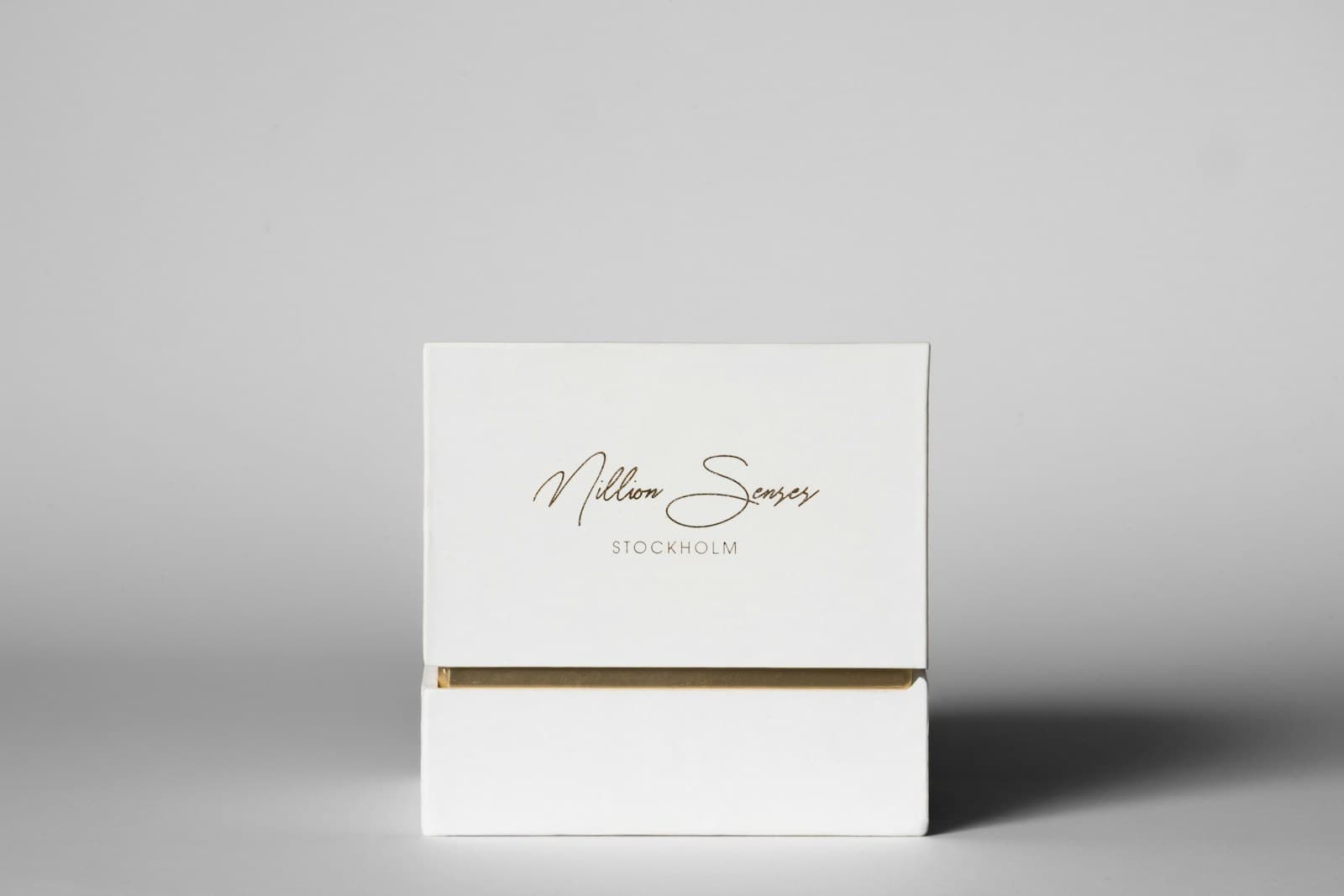White box with gold trim and text