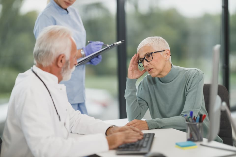 Patient talking privately with a doctor during a confidential medical consultation
