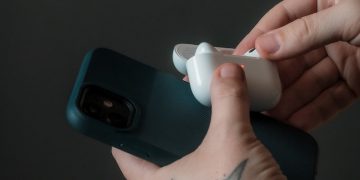 person holding white ceramic mug