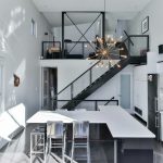 a kitchen with a staircase