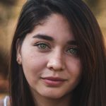 woman with brown hair smiling