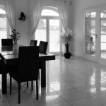 a black and white photo of a dining room