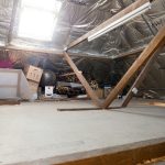 An attic with some stored items is pictured.