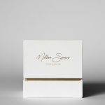 White box with gold trim and text