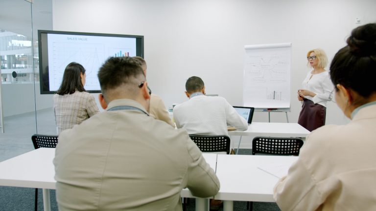 Business people in a modern conference room during a presentation.