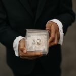 a man holding a picture of a man