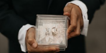 a man holding a picture of a man