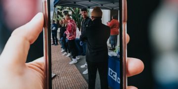 person holding black samsung android smartphone