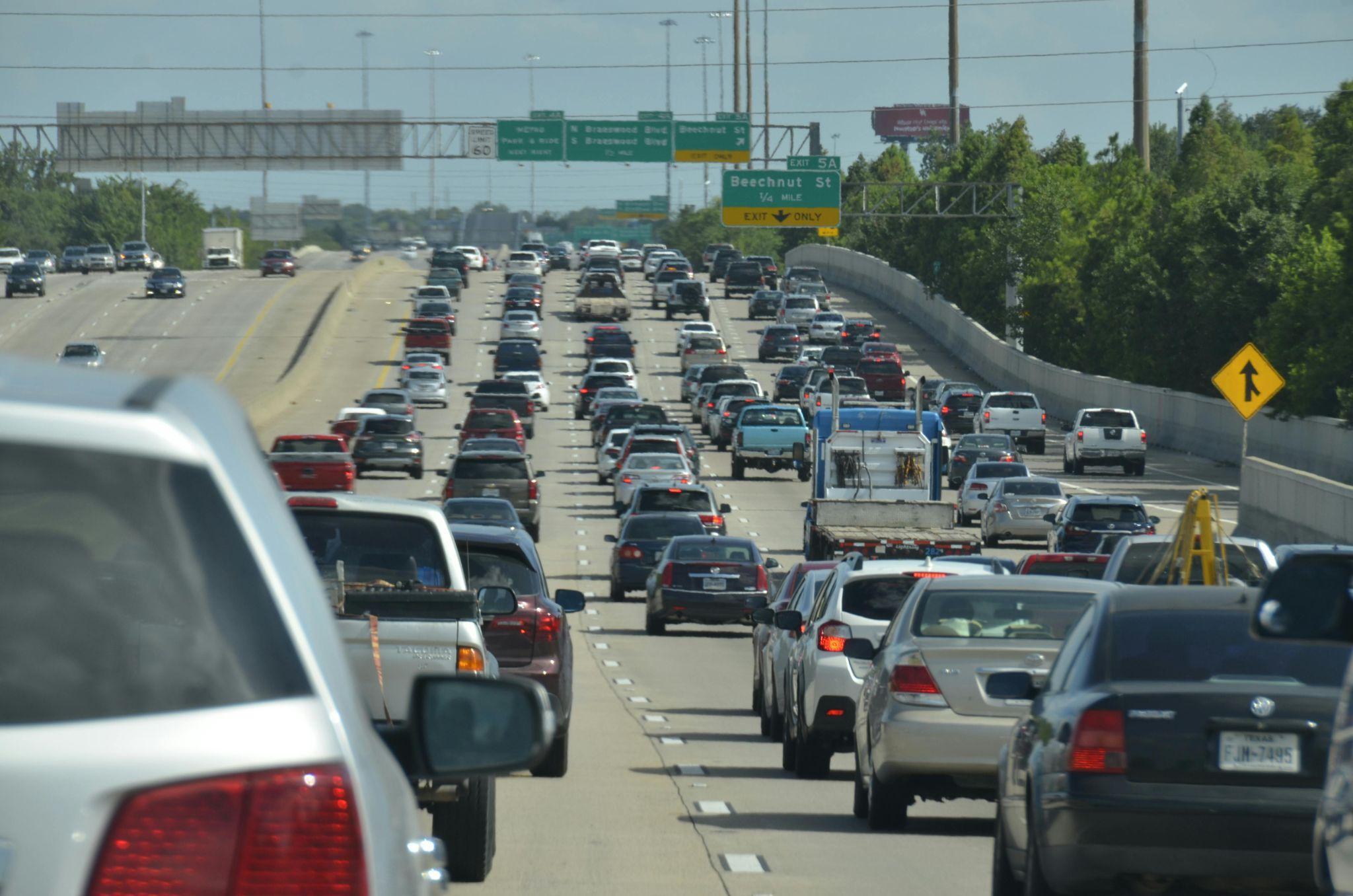 Busy urban traffic with motorcyclists illustrating insurance risks